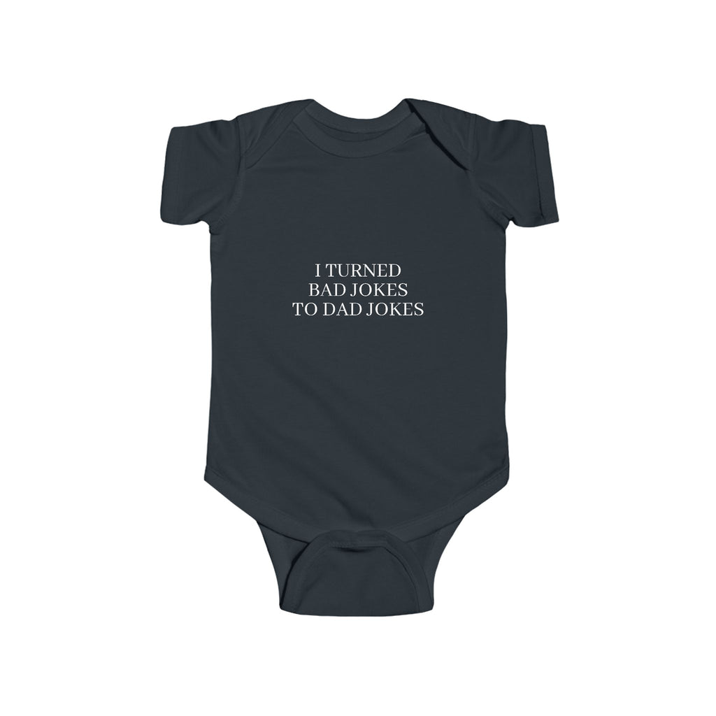 Infant “I TURN BAD JOKES TO DAD JOKES” Fine Jersey Bodysuit